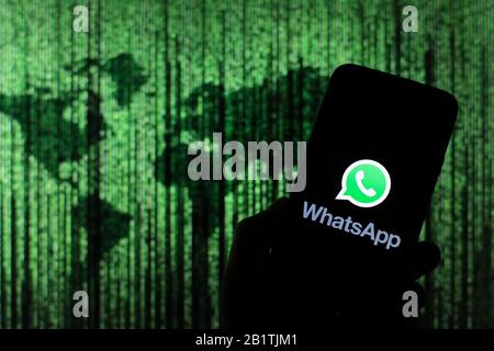 In this photo illustration a WhatsApp messenger app logo seen displayed on a smartphone. Stock Photo