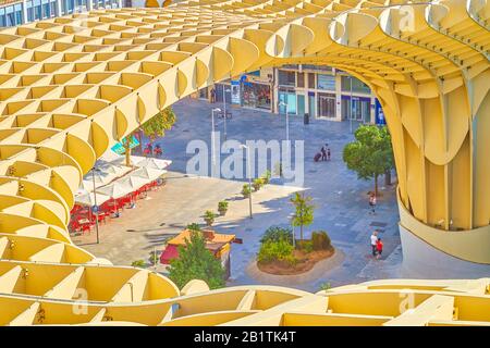 SEVILLE, SPAIN - OCTOBER 1, 2019: The aerial view on Plaza de la Encarnacion with outdoor cafe from the viewpoint of Metropol Parasol, October 1 in Se