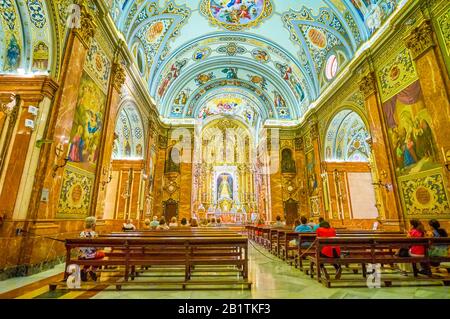 SEVILLE, SPAIN - OCTOBER 1, 2019: The evening masse in beautiful Basilica Macarena with the sculpture of Virgin of Macarena in Altar, on October 1 in Stock Photo