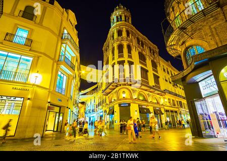 SEVILLE, SPAIN - OCTOBER 1, 2019: The bright showcases of department stores and boutiques in shopping area in old town, on October 1 in Seville Stock Photo