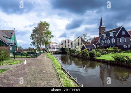 Traditional wooden fishing houses, canal and cat, Marken, Netherlands. Typical view of north Holland Stock Photo