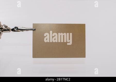 Orange, brown blank business card on white background. Beige glossy rectangle card Stock Photo