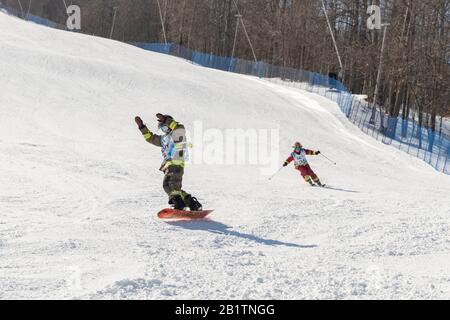 Downhill skiing and snowboarding Stock Photo