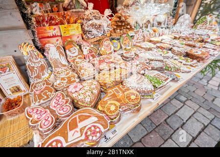 Riga, Latvia - December 08 2019. Christmas market on Dome Square, in the Old Town. People buying traditional souvenirs at a European Christmas market Stock Photo