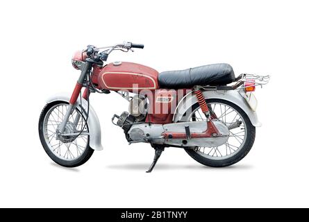 Red rusty old motorcycle isolated on white Stock Photo
