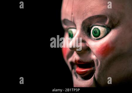 Creepy doll head in the dark Stock Photo