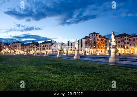 The statues of the square of Prato della Valle in Padova after sunset, Italy, after rain. View of the basilica on Prato della Valle in Padova at night Stock Photo