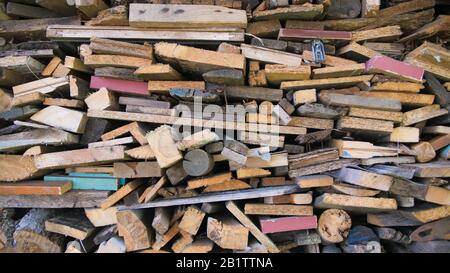 Multi-colored firewood with sticks for the stove. Stock Photo