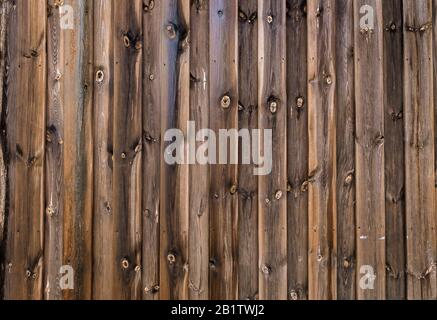 Rough wooden wall with flamed planks background texture Stock Photo