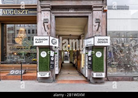 Budapest, Hungary - November 17, 2019: Entrance to Paloma fashion and art courtyard and Auguszt confectionery cake shop on Kossuth Lajos street. Stock Photo