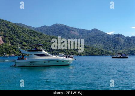 Angra dos Reis, Rio de Janeiro, December 31, 2019:Motorboat in Angra dos Reis bay area during the summer time. Wealth people use boats to find the bes Stock Photo