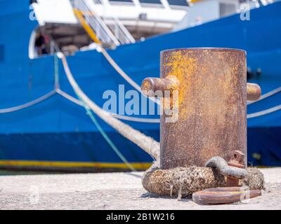 hawser rope keep the ferry boat at the port Stock Photo