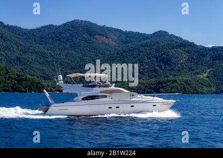 Angra dos Reis, Rio de Janeiro, Brazil - December 31, 2019: Motor Boat in Angra dos Reis bay area during the summer time. The wealth people use these Stock Photo