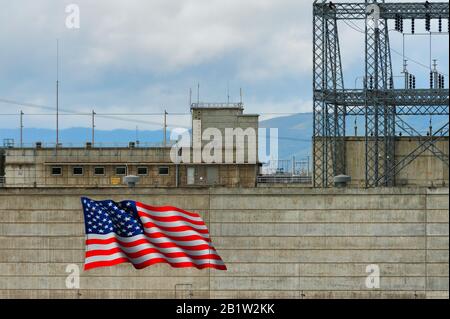 The Dalles, Oregon,USA - March 34, 2016:  The United States Flag is painted on the side of a section of The Dalles Damn and is quite visible from I-84 Stock Photo