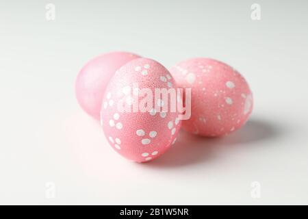 Pink easter eggs on white background, close up Stock Photo