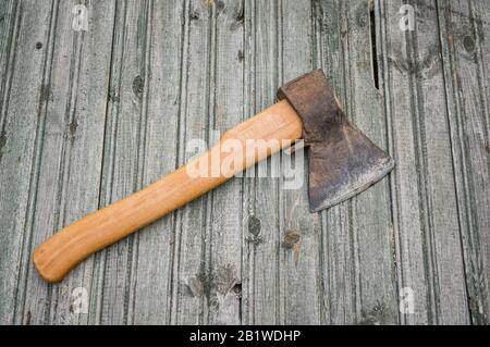 Vintage ax on wooden background. Soft focus. Copy space. Stock Photo