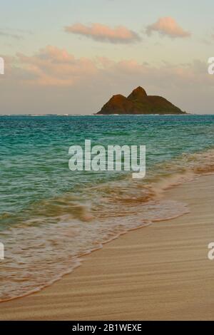 Tropical turquoise waters at sunset off Lanikai Beach, waves breaking ...