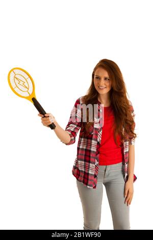 attractive Beautiful young woman holds electroc racket for kiling flys Stock Photo