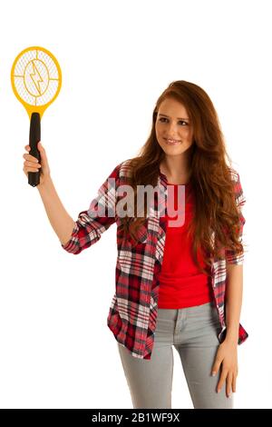 attractive Beautiful young woman holds electroc racket for kiling flys Stock Photo