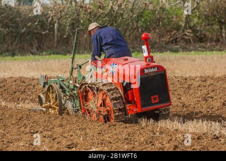 Vintage class Bristol crawler tractor Ploughing furrow field plough England Farming   Match Competition Country Stock Photo