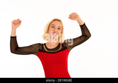 Attrctive young blonde woman gesture success with arms up isolated over white background Stock Photo