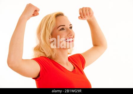 Attrctive young blonde woman gesture success with arms up isolated over white background Stock Photo