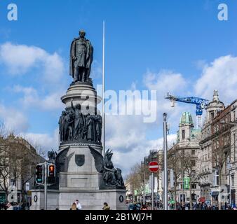 The statue of Daniel O'Connell the 'Catholic Emancipator'  in O'Connell Street, Dublin, Ireland,unveiled in 1882 and designed by John Henry Foley. Stock Photo