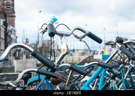 Amsterdam, the Netherlands, 27 February Bikes standing in front of the Basiliek van de Heilige Nicolaas in the Dutch city of Amsterdam Stock Photo