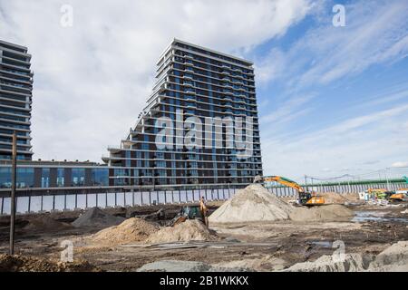 Residential Construction Site, New Apartment Building Industry, Tower Cranes And Industrial Machinery Stock Photo