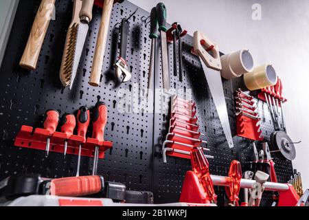 Toolkit Tools On Metal Board In Garage Stock Photo