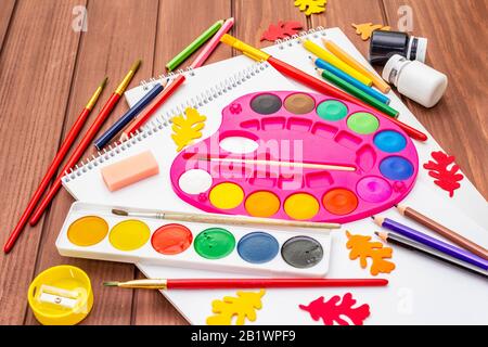 Back to school concept. School education supplies on brown wooden boards background, flat lay Stock Photo