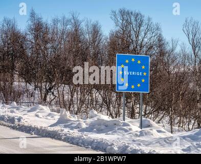 The information about border of European Union, road sign at Sweden Norway border, at Swedish customs. Winter sunny day in Scandinavian Mountains Stock Photo