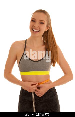 Beautiful fit woman measures waste isolated over white background Stock Photo