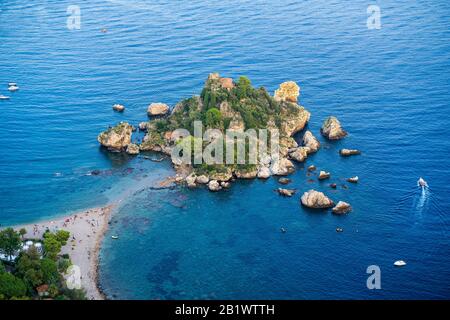 Aerial view of island and Isola Bella beach with people and a nearby boat near Taormina, Sicily, Italy Stock Photo