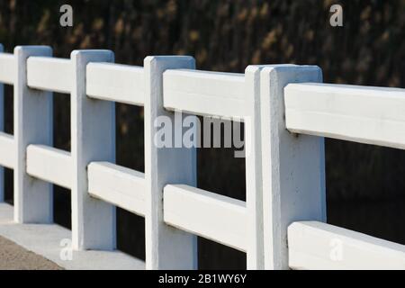 Concrete Guardrail On Sidewalk Bridge Crossing Stock Photo