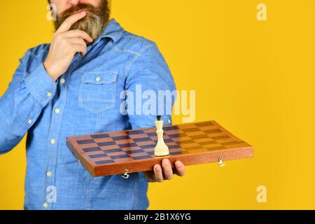 Chess lesson. Cognitive development. Enjoy tournament. Strategy concept. Chess competition. Board game. Thoughtful bearded man play chess. Chess figure. Intellectual game. Grandmaster player. Stock Photo