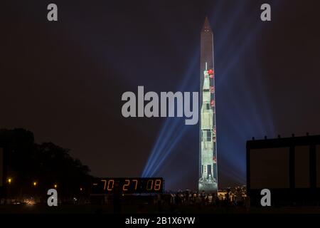 Washington DC, July 16 2019: Apollo 50: Go for the Moon show projects a 363-foot Saturn V rocket on the east face of the Washington Monument. This is Stock Photo