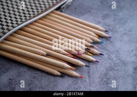 Close up of colorful drawing pencils on table  Stock Photo