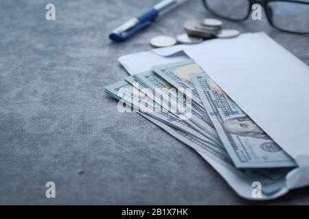 Close up of cash in a wallet on table  Stock Photo