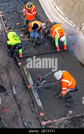 Aerial view of construction workers on a building site. Stock Photo