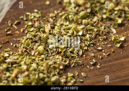 Raw Dried Green Greek Oregano Spice in a Bowl Stock Photo