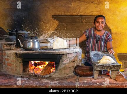 Mexico, Oaxaca, Woman making tortillas outside on traditional comal griddle  Stock Photo - Alamy