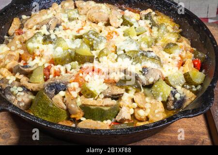 Vegan stew in a cast iron frying pan Stock Photo