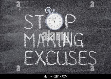 stop making excuses phrase written on chalkboard with vintage precise stopwatch Stock Photo