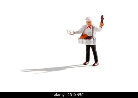 Ice cream seller man miniature isolated on white background with shadow and copy space Stock Photo