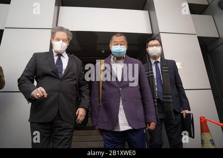 Hong Kong, China's Hong Kong. 28th Feb, 2020. Jimmy Lai Chee-ying (C), instigator of the Hong Kong riots, leaves a police station after being granted bail in south China's Hong Kong, Feb. 28, 2020. Hong Kong police said at a press briefing on Friday that three Hong Kong residents were arrested for unauthorized assembly and are scheduled to appear before court on May 5. It is reported that the three are Jimmy Lai Chee-ying, instigator of the Hong Kong riots, and two opposition figures Lee Cheuk-yan and Yeung Sum. Credit: Lui Siu Wai/Xinhua/Alamy Live News Stock Photo