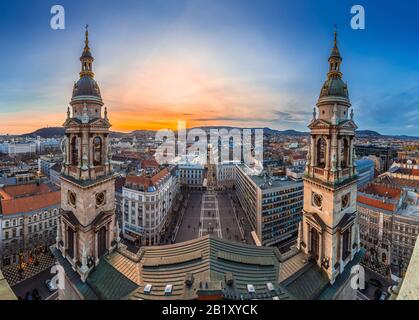 Budapest, Hungary - Aerial skyline view of Budapest taken from the top of St.Stephen's Basilica at sunset. The view includes two towers of basilica, S Stock Photo