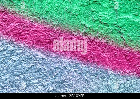 Abstract texture of plaster of silver green and pink lines. Close up. Stock Photo