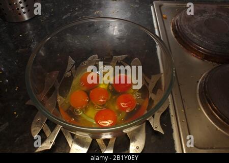 Six cracked eggs Stock Photo