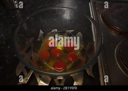 Six cracked eggs Stock Photo